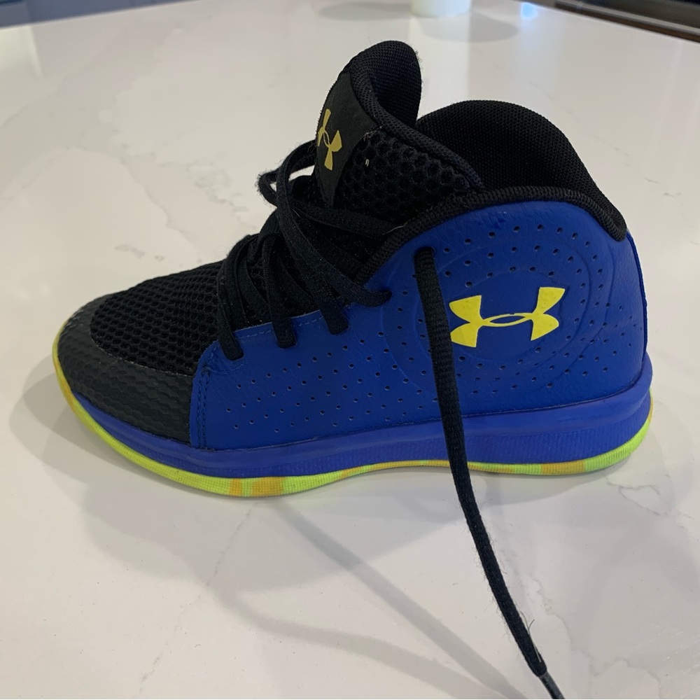 Size 1Y blue Under Armour basketball shoes.